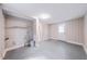 Unfinished basement with painted floor, utility hookups, and access to outdoors at 1251 Richland Sw Rd, Atlanta, GA 30310
