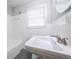 Bathroom featuring a clean, white tiled shower and sink at 1251 Richland Sw Rd, Atlanta, GA 30310