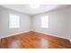 Bedroom with hardwood floors and two windows with blinds at 1251 Richland Sw Rd, Atlanta, GA 30310