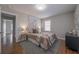 Serene bedroom with hardwood floors, neutral tones, and ample natural light at 1251 Richland Sw Rd, Atlanta, GA 30310