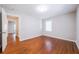 Bedroom with hardwood floors, light-colored walls, and plenty of natural light at 1251 Richland Sw Rd, Atlanta, GA 30310