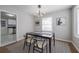 Bright dining room with modern light fixture and stylish decor with easy access to kitchen at 1251 Richland Sw Rd, Atlanta, GA 30310