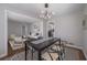 Bright dining room with modern light fixture and stylish decor with easy access to living room at 1251 Richland Sw Rd, Atlanta, GA 30310