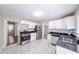 Modern kitchen with white cabinets, stainless steel appliances, and ample counter space at 1251 Richland Sw Rd, Atlanta, GA 30310