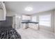 Well-lit kitchen features white cabinets, stainless steel appliances, and modern countertops at 1251 Richland Sw Rd, Atlanta, GA 30310