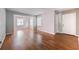 Spacious living room with hardwood floors and open access to the dining room, perfect for entertaining guests at 1251 Richland Sw Rd, Atlanta, GA 30310