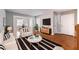 Bright living room showcasing modern decor, hardwood floors, and an open layout leading to the dining area at 1251 Richland Sw Rd, Atlanta, GA 30310