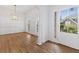 Elegant dining room featuring hardwood floors, wainscoting, and a modern chandelier fixture at 1711 Summit Glen Ln, Atlanta, GA 30329