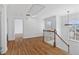 Hallway with hardwood flooring, white trim, and lots of natural light at 1711 Summit Glen Ln, Atlanta, GA 30329