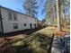 Backyard of house with turf and trees at 3042 Humphries Hill Rd, Austell, GA 30106