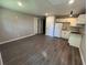 This living room features grey floors, and open concept to the kitchen at 3042 Humphries Hill Rd, Austell, GA 30106