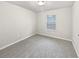 Neutral bedroom with carpet floors and a window, perfect for relaxation at 3282 Spicy Cedar Ln, Lithonia, GA 30038