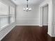 Light-filled dining room with hardwood floors and elegant chandelier at 3282 Spicy Cedar Ln, Lithonia, GA 30038