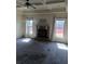 Cozy living room with a brick fireplace, coffered ceilings, and bright windows at 8413 Members Dr, Jonesboro, GA 30236