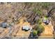 An aerial view showcases the home's placement among mature trees and neighborhood homes at 4094 Yancey Rd, Douglasville, GA 30135