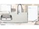 Kitchen materials showing the faucet, cabinetry, counter top, and tile selection for a linen collection at 504 Healy Dr # 75, Cumming, GA 30040