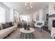 Spacious living room with open access to the kitchen and dining area at 504 Healy Dr # 75, Cumming, GA 30040