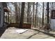 Spacious wooden deck in a wooded backyard, perfect for outdoor relaxation and entertaining at 1302 Buttercup Ct, Lawrenceville, GA 30044