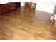 Spacious bedroom featuring gleaming hardwood floors, creating a warm and inviting ambiance at 1302 Buttercup Ct, Lawrenceville, GA 30044