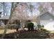 Charming one-story home featuring an attached garage and a well-maintained front yard with flowering trees at 1302 Buttercup Ct, Lawrenceville, GA 30044