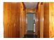 Bright hallway with wood-paneled walls and doors, offering a cozy and inviting atmosphere at 1302 Buttercup Ct, Lawrenceville, GA 30044
