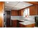 Functional kitchen with wooden cabinets, white tile backsplash, and stainless steel appliances at 1302 Buttercup Ct, Lawrenceville, GA 30044