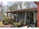 Inviting porch area with ceiling fans and shade, lined with potted plants at 1302 Buttercup Ct, Lawrenceville, GA 30044