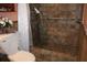 Nicely tiled walk-in shower with a grab bar and shower head, adding comfort and convenience at 1302 Buttercup Ct, Lawrenceville, GA 30044