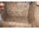 Tiled walk-in shower featuring a multi-toned design, grab bar, and convenient shower head at 1302 Buttercup Ct, Lawrenceville, GA 30044