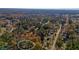 High-angle neighborhood view featuring property surrounded by established trees and nearby community at 3310 Bryan Way, Marietta, GA 30008