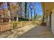Large wooden deck surrounded by lush trees with a wooden railing at 3310 Bryan Way, Marietta, GA 30008