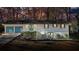 Charming home featuring a two-car garage, complemented by a welcoming front porch and lush surroundings at 3310 Bryan Way, Marietta, GA 30008