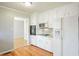 White kitchen with stainless appliances and marble backsplash at 3310 Bryan Way, Marietta, GA 30008