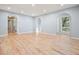 Bright living room featuring beautiful hardwood floors, recessed lighting, and arched doorways at 3310 Bryan Way, Marietta, GA 30008