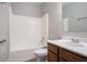 Bathroom featuring a shower-tub combo and vanity with dark wood cabinets at 7416 Toccoa Cir, Union City, GA 30291