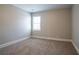 Neutral bedroom with carpet, white trim and a window with blinds at 7416 Toccoa Cir, Union City, GA 30291