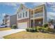 Attractive two-story home with a brick and shingle exterior, two-car garage, and a second story balcony at 7416 Toccoa Cir, Union City, GA 30291