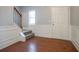 Entryway featuring hardwood floors, decorative molding, and staircase at 7416 Toccoa Cir, Union City, GA 30291