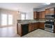Well-lit kitchen featuring stainless steel appliances, granite countertops, and an open layout at 7416 Toccoa Cir, Union City, GA 30291
