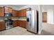 Modern kitchen featuring stainless steel appliances, tile backsplash, and abundant cabinet storage space at 7416 Toccoa Cir, Union City, GA 30291
