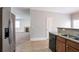 Spacious kitchen featuring stainless steel appliances and views into the adjacent living area at 7416 Toccoa Cir, Union City, GA 30291