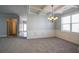 Spacious open living area with large window and carpet flooring at 7416 Toccoa Cir, Union City, GA 30291
