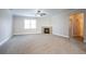 Open living room featuring plush carpeting, crown molding, a ceiling fan, and a cozy fireplace at 7416 Toccoa Cir, Union City, GA 30291