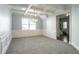 Elegant living room featuring coffered ceilings, chair rail, and a chandelier at 7416 Toccoa Cir, Union City, GA 30291