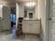 Bathroom featuring a vanity with granite countertop and gray tile flooring at 338 Cherryhill Ln, Woodstock, GA 30188