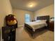 Bedroom with wood frame bed and neutral decor and natural light at 338 Cherryhill Ln, Woodstock, GA 30188