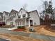 Charming townhome with a well-manicured lawn and a two-car garage at 338 Cherryhill Ln, Woodstock, GA 30188