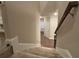 Carpeted staircase leading to the entry and main living areas at 338 Cherryhill Ln, Woodstock, GA 30188