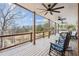 A porch with ceiling fans overlooking the surrounding woodlands at 8 Colonial Club Se Dr, Acworth, GA 30102