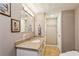 Inviting bathroom with granite vanity, tiled floors, warm lighting, and neutral-toned walls at 8 Colonial Club Se Dr, Acworth, GA 30102